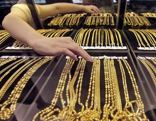 Gold exchange game: Demand and supply
